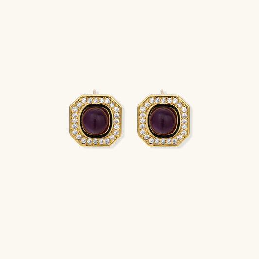 Gold-plated octagonal stud earrings with burgundy liuli centers and cubic zirconia halos on white background