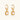 Pair of gold vermeil hoop earrings with textured square frames holding freshwater pearls on cream background