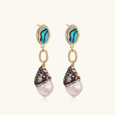 Gold drop earrings with iridescent abalone studs, rope links, jeweled caps and white baroque pearls on cream background