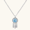 Sterling silver dreamcatcher pendant with blue moissanite center and three feather charms on adjustable chain.