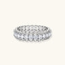 Sterling silver eternity ring with continuous row of brilliant moissanite stones in scalloped crown setting with milgrain detail
