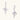 White gold-plated hoop earrings with sparkling zirconia cross charms dangling against cream background