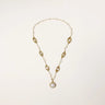 14K gold plated necklace with organic leaf motifs and freshwater pearls arranged in an elegant chain design on neutral background.